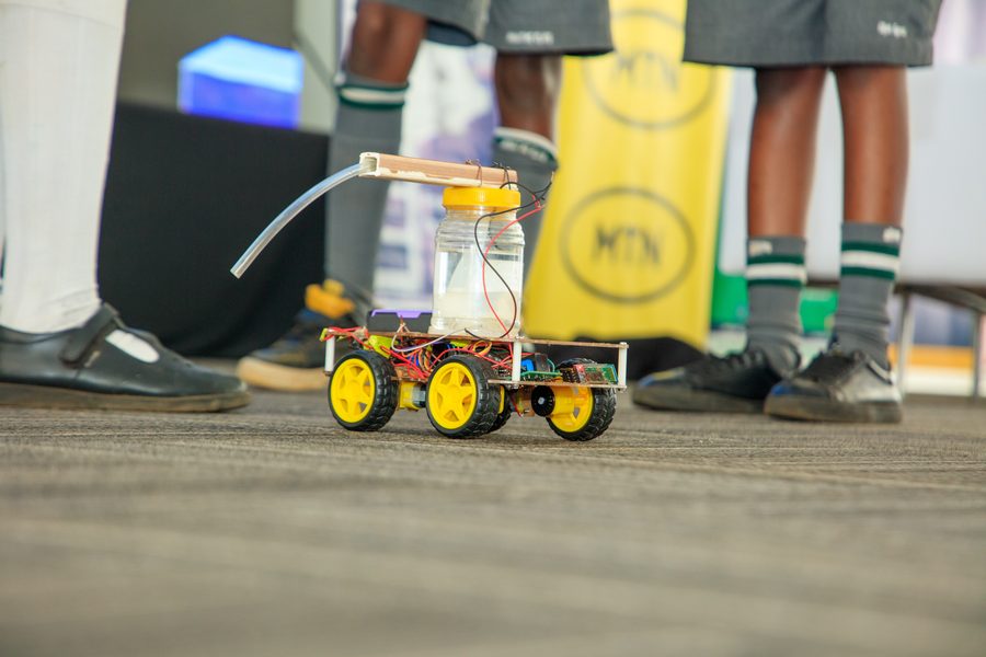 A small wheeled robot on the floor at the Uganda National Championship